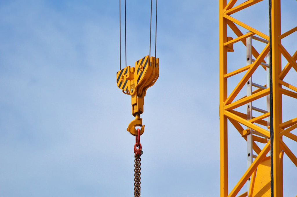 A closeup of a yellow crane