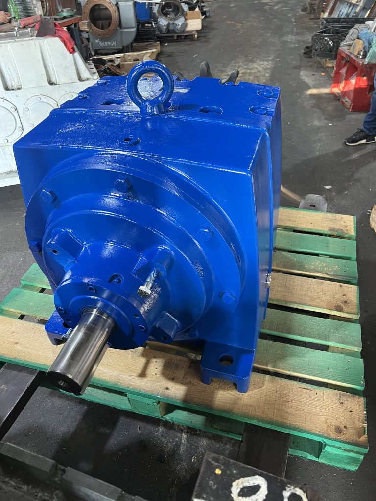 Industrial gearbox being disassembled for complete repair and rebuilding.