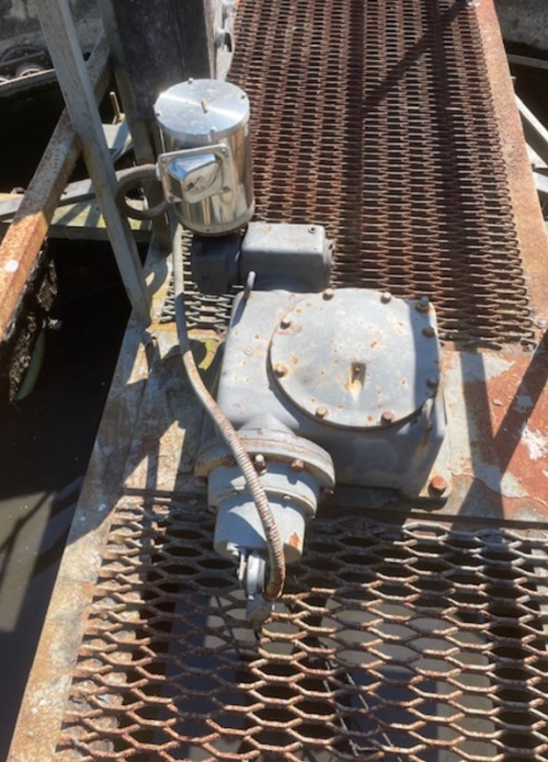 This image shows a gearbox with an electric motorImage Caption: Understanding early gearbox stress signals is important